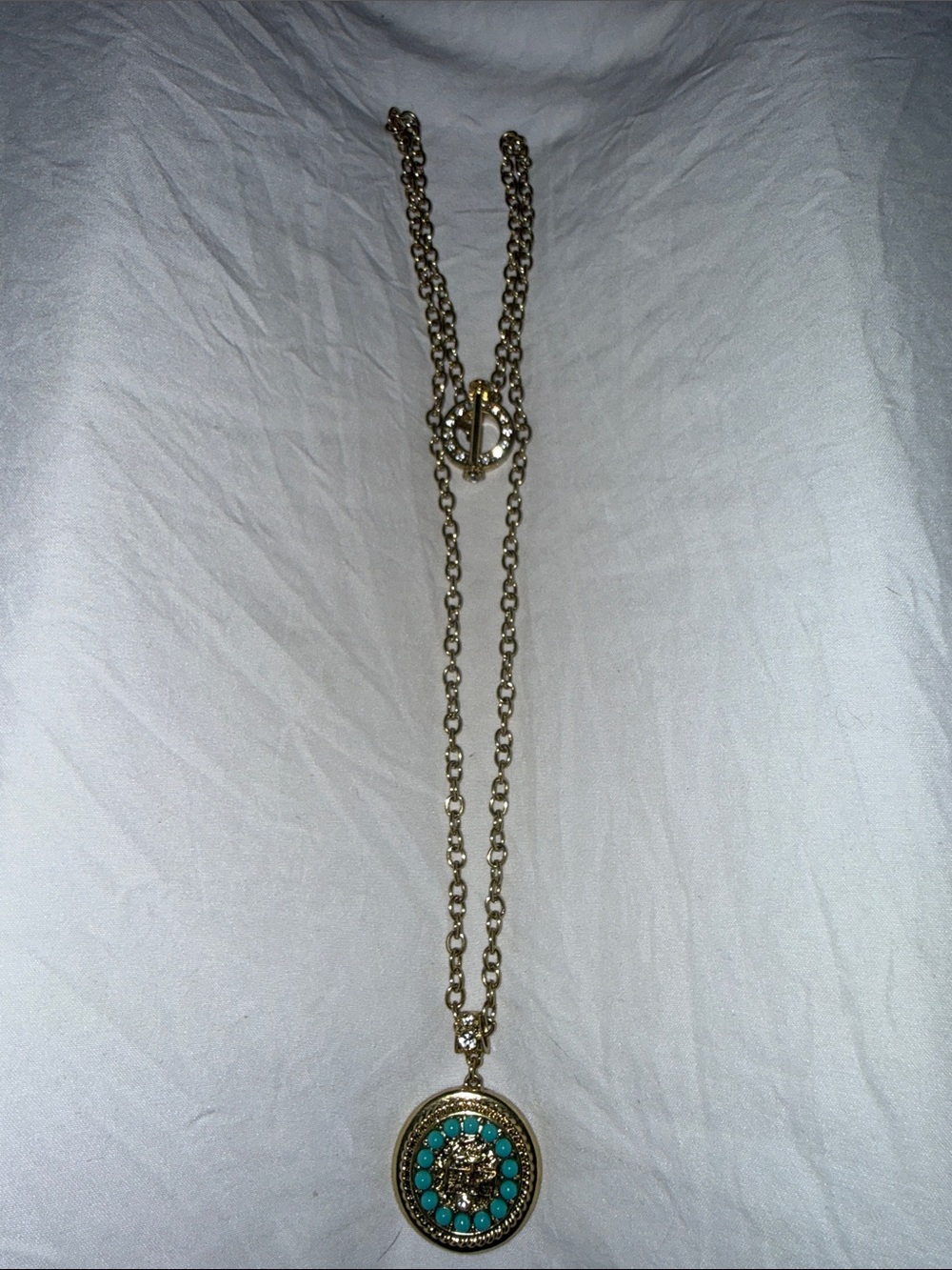 Heidi Daus Gold-Tone Pendant Necklace with Turquoise Accents. No missing stones